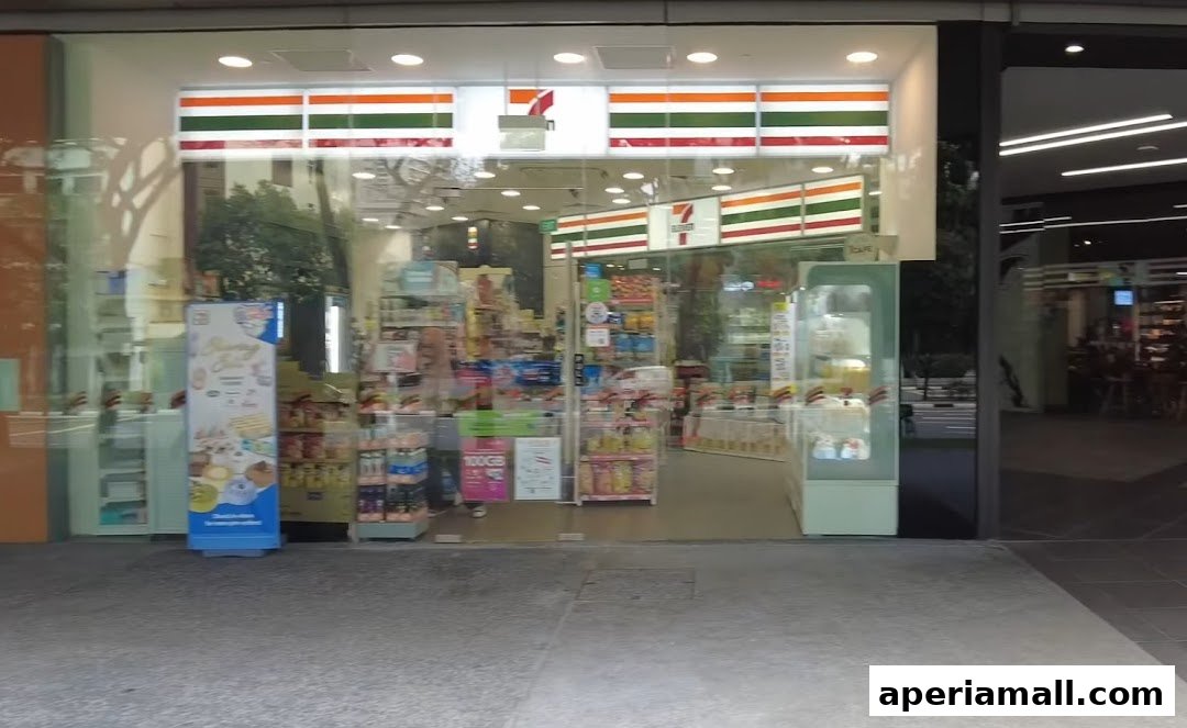 The exterior of a brightly lit 7-Eleven convenience store with its iconic logo and colorful displays.