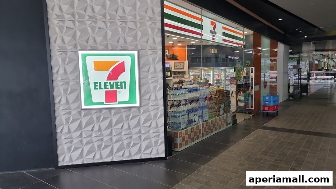 The exterior of a 7-Eleven convenience store with its logo and stocked shelves visible through the glass.