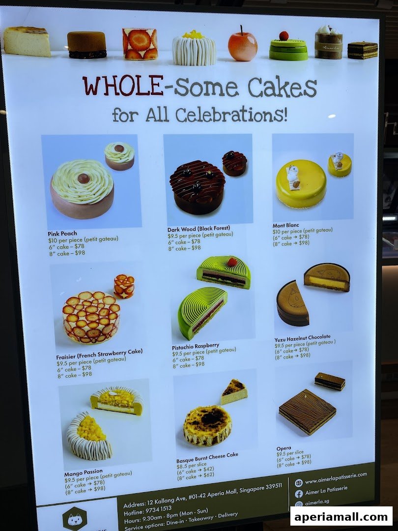 A menu display showcasing various whole cakes and petit gateaux from Aimer La Patisserie.