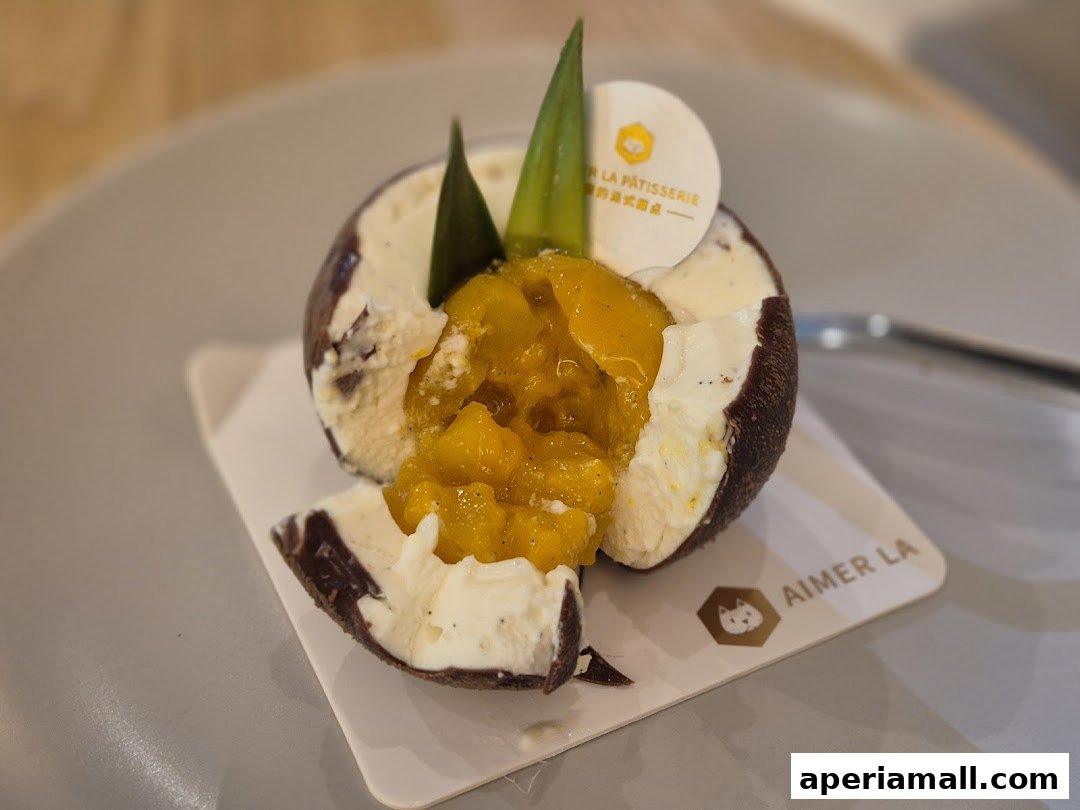 A close-up of a decadent dessert with a creamy white exterior and a vibrant yellow fruit filling.