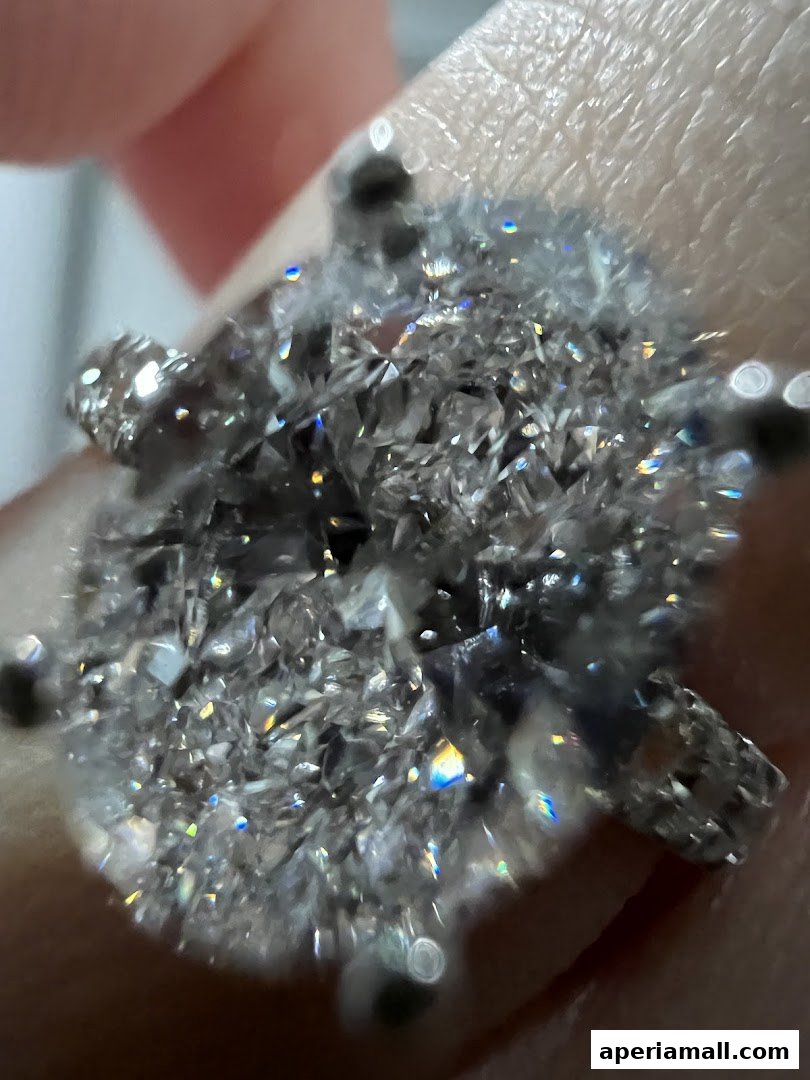 A close-up shot of a dazzling diamond ring sparkling with light.