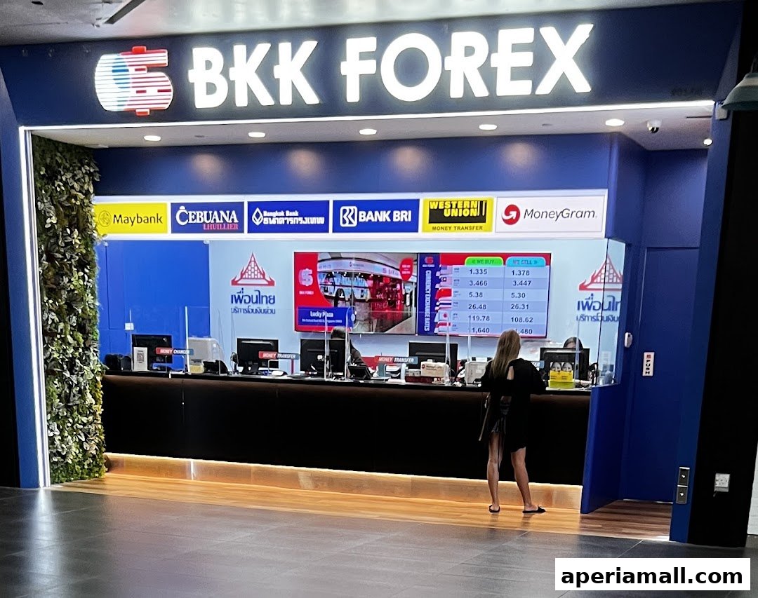 BKK Forex shop front with currency exchange rates displayed on a screen.