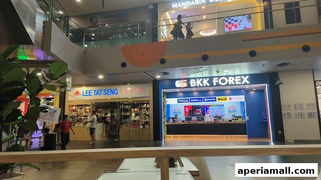 The BKK Forex shop front is visible next to Lee Tat Seng in a shopping mall.