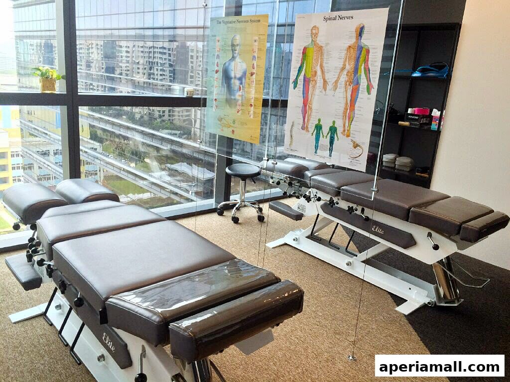 Chiropractic treatment tables and anatomical charts in a modern clinic with city views.