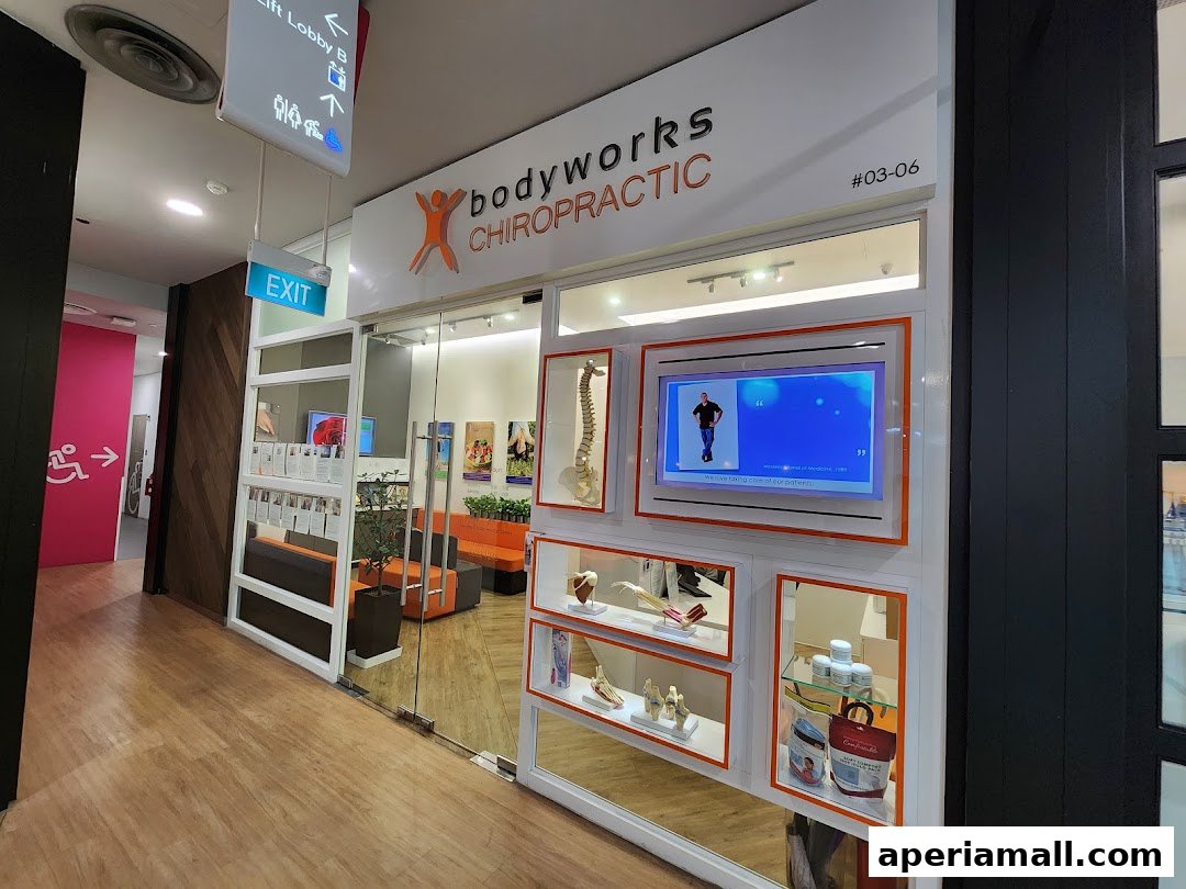 The entrance of Bodyworks Chiropractic Singapore, showcasing its modern interior and display of anatomical models.