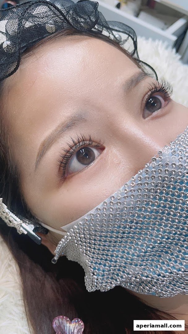 Close-up of a woman's eye with beautifully applied eyelash extensions.