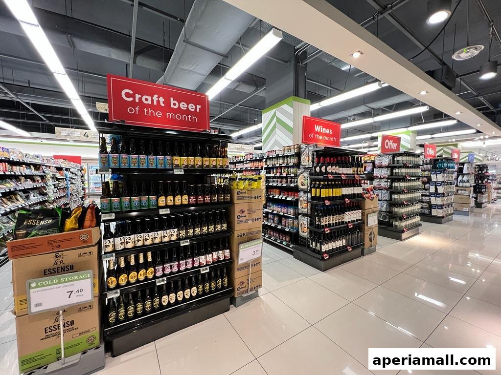 Aisle in a supermarket featuring craft beer, wines, and special offers.