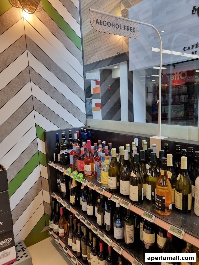 Shelves stocked with various bottles of wine and spirits, with an 'Alcohol Free' sign.