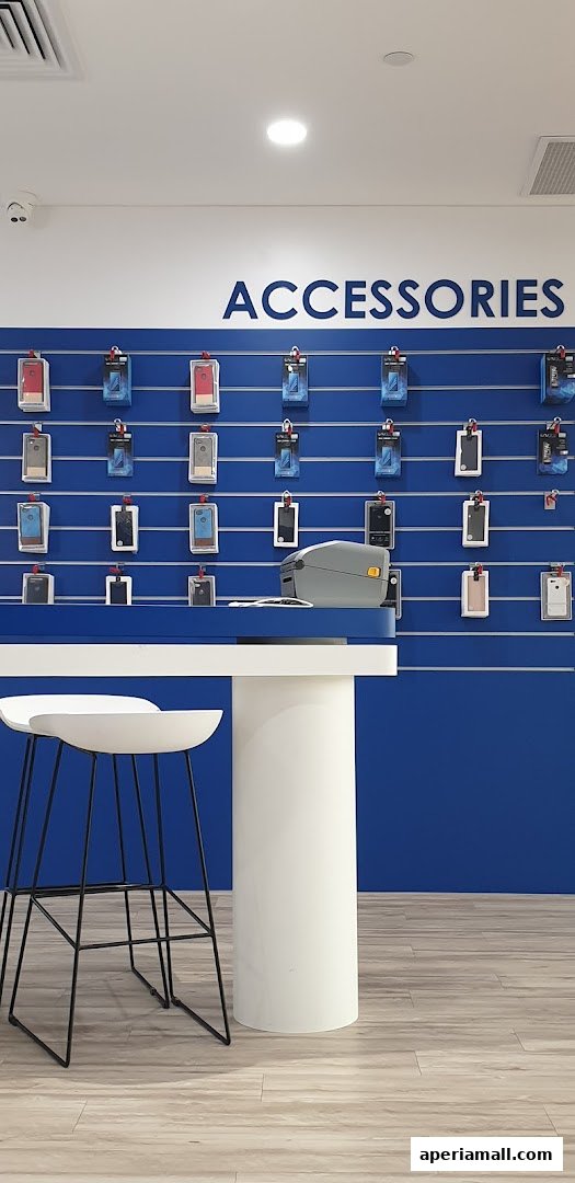 A retail store display featuring various phone accessories neatly arranged on a blue wall.