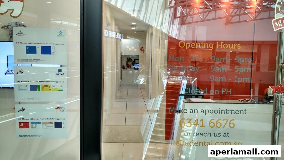 The entrance to Delta Dental, showing their opening hours and contact information on the glass.