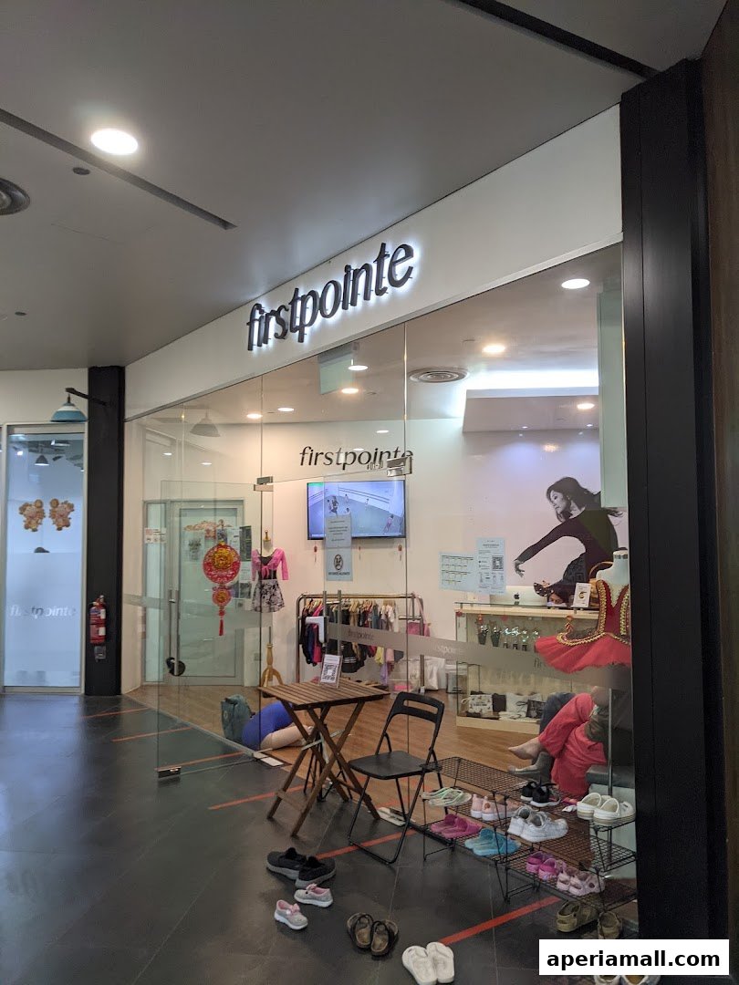 Firstpointe School of Dance shop front with dancewear and shoes displayed.