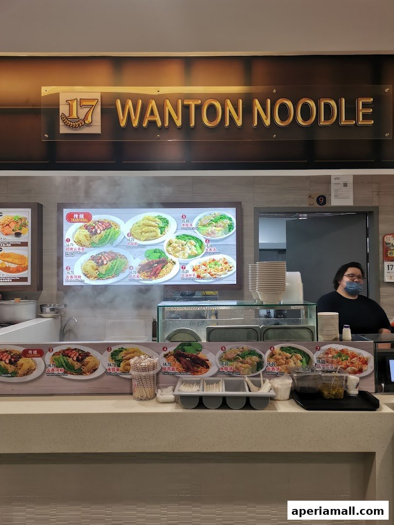 A food stall displaying various noodle and dumpling dishes with prices.