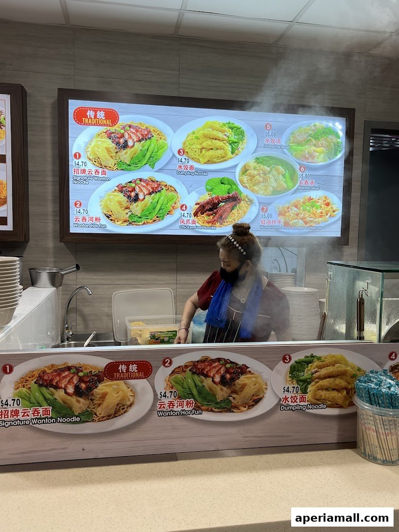 A food display featuring various noodle dishes and soups with prices and descriptions.