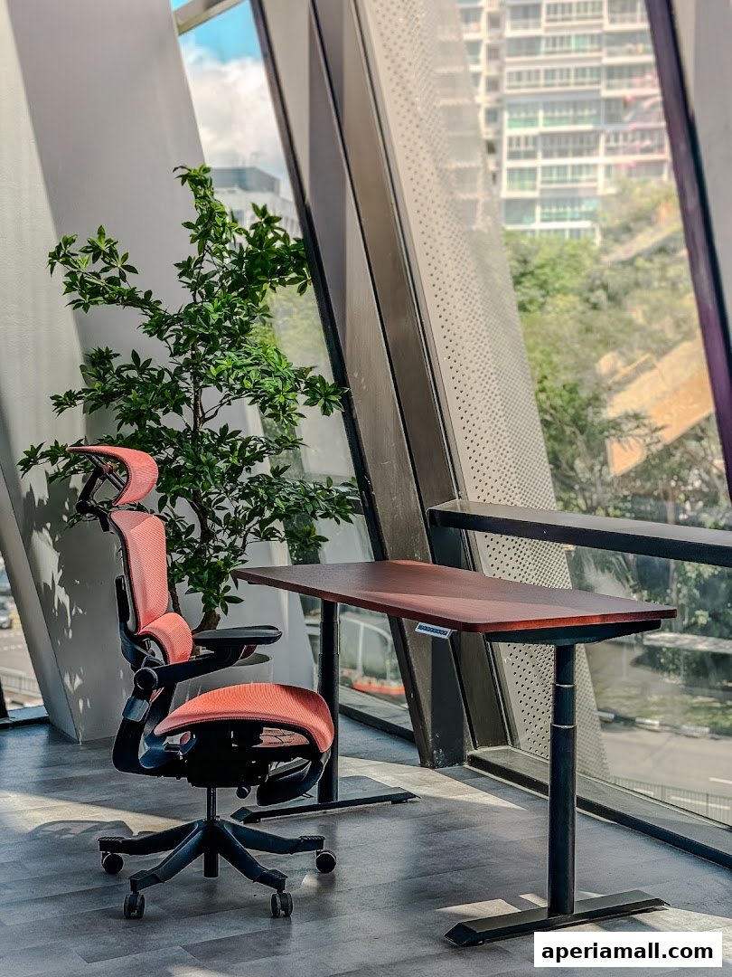 An ergonomic chair and a standing desk are set up by a window with a city view.