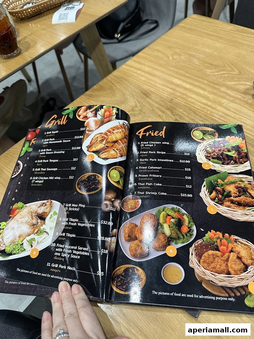 A menu from Im-Em Thai Kitchen featuring grilled and fried dishes with enticing food photography.