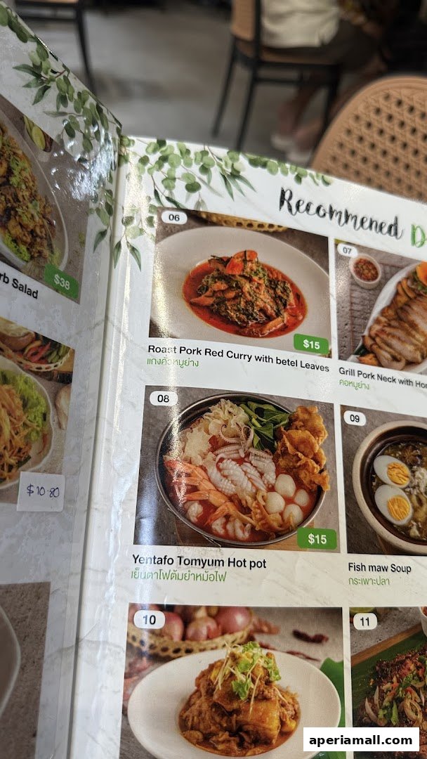 A menu from Im-Em Thai Kitchen featuring recommended dishes like Roast Pork Red Curry and Yentafo Tomyum Hot pot.