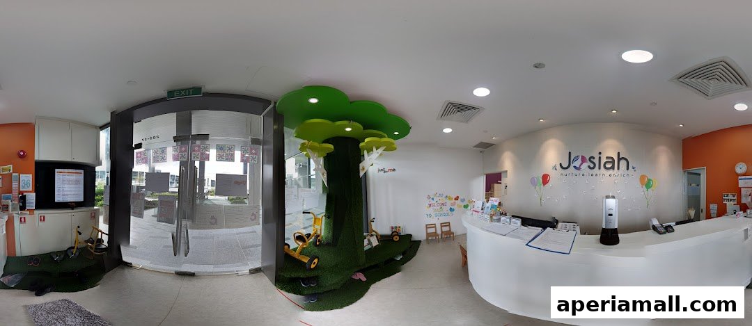 The welcoming reception area of Josiah, a learning center, with a playful tree and a reception desk.