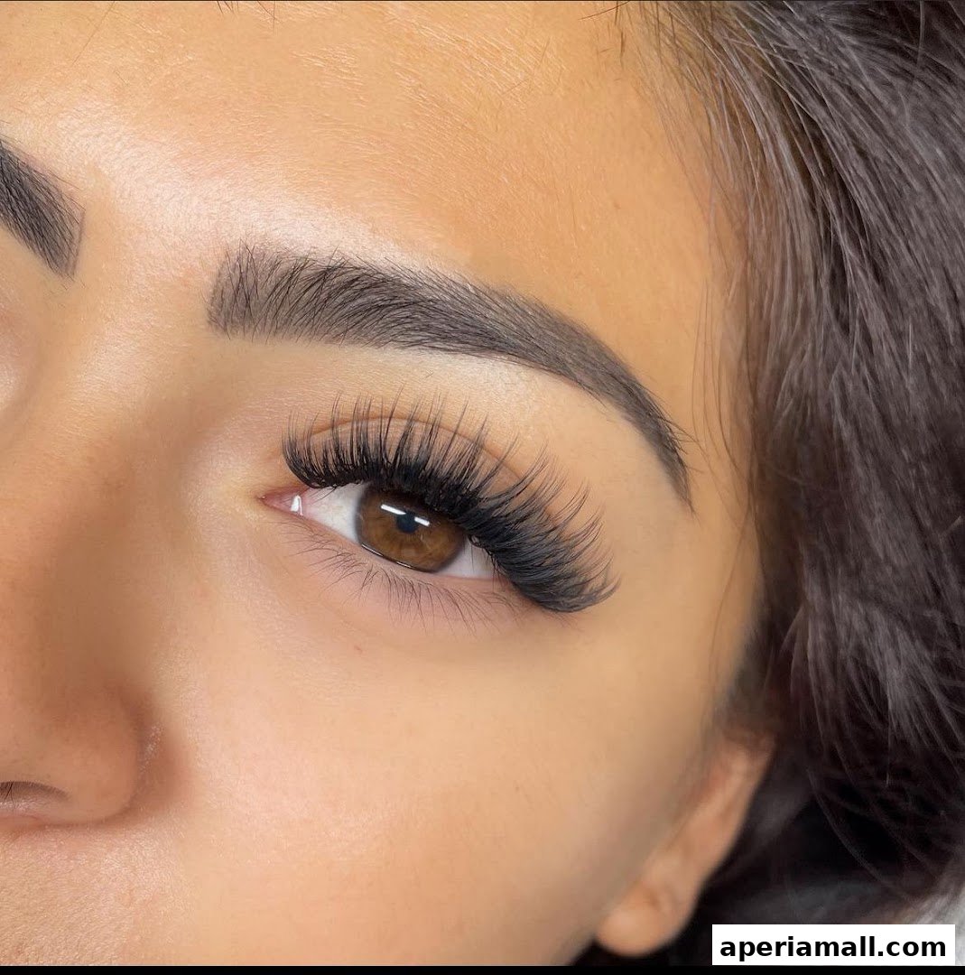 Close-up of a woman's eye with dramatic, voluminous eyelash extensions.