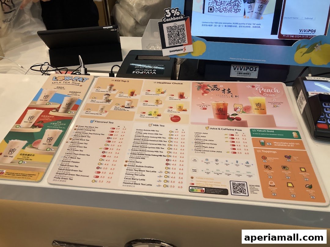 A menu for KOI Thé featuring milk teas, flavored teas, juices, and toppings.