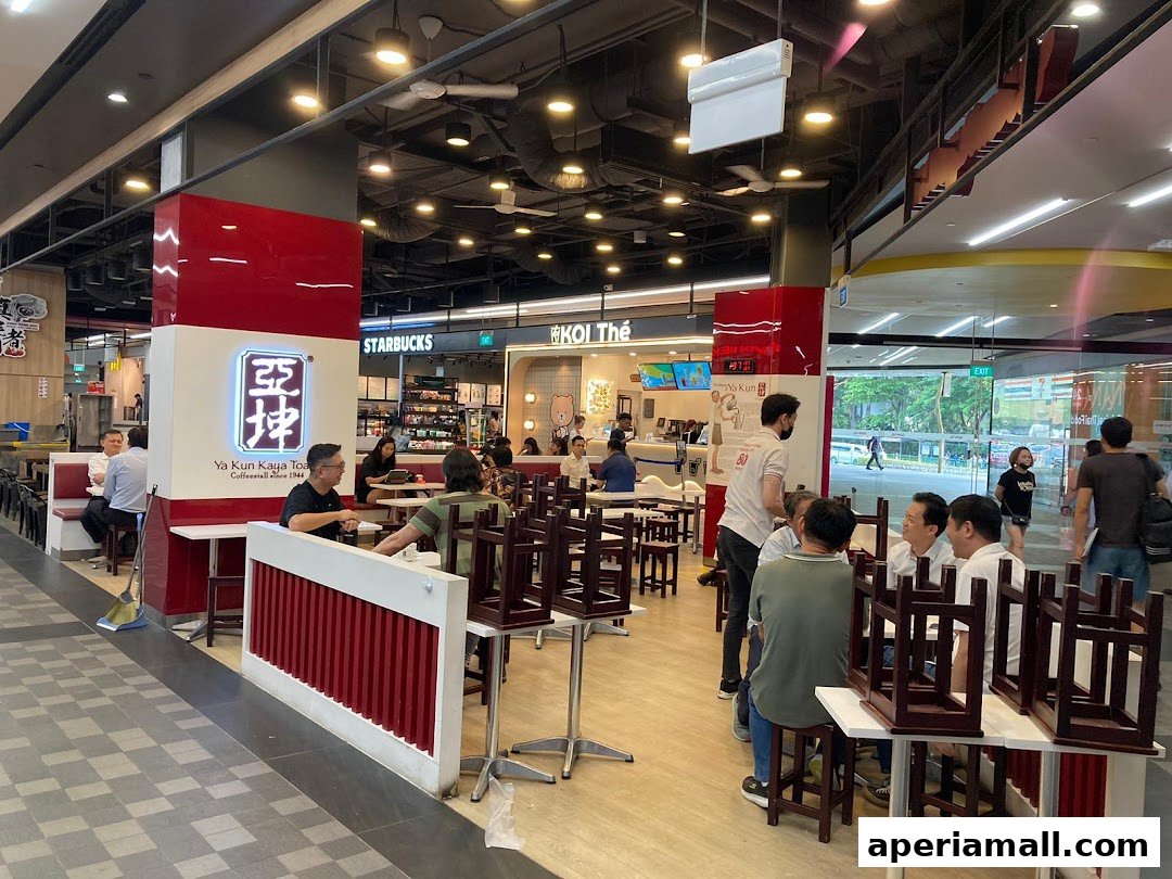 People dining at Ya Kun Kaya Toast and KOI Thé in a mall.