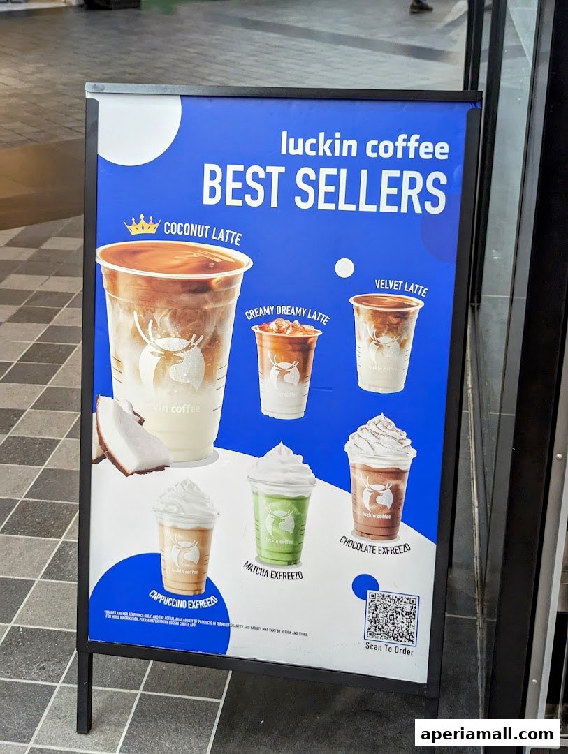 A-frame sign displaying Luckin Coffee's best-selling drinks with images and names.