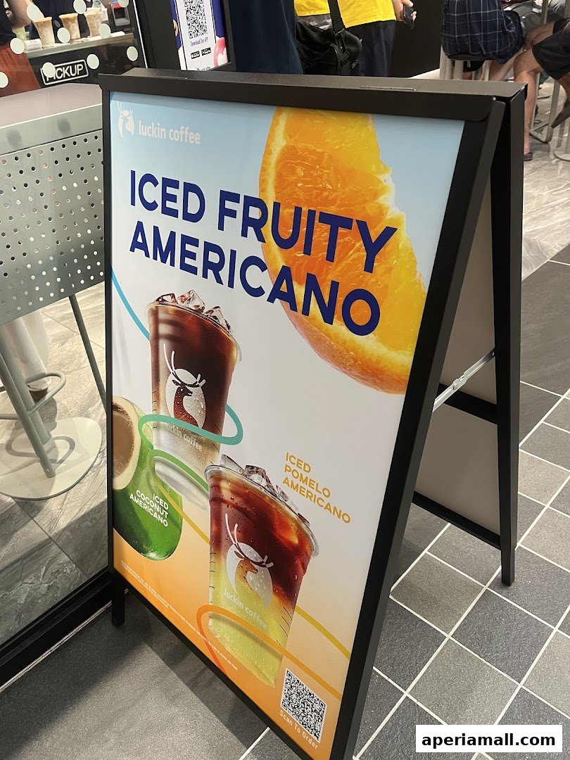 A-frame sign advertising Luckin Coffee's Iced Fruity Americano drinks.