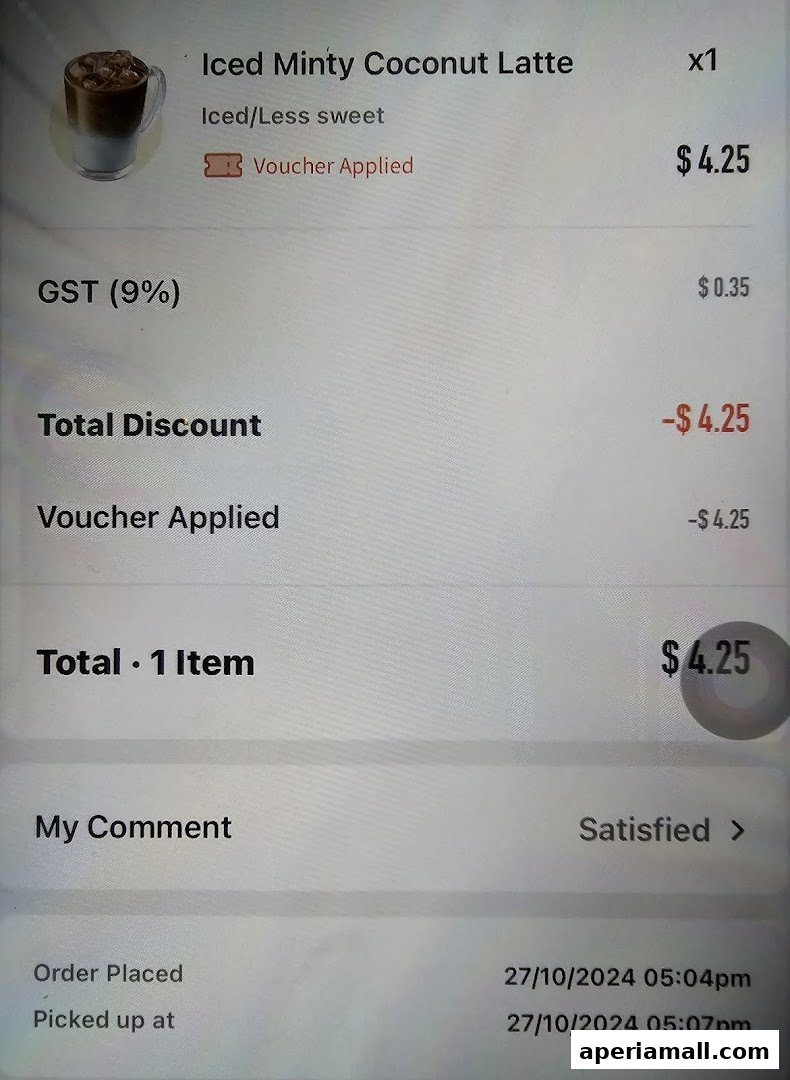 A receipt showing an Iced Minty Coconut Latte with applied voucher and GST.