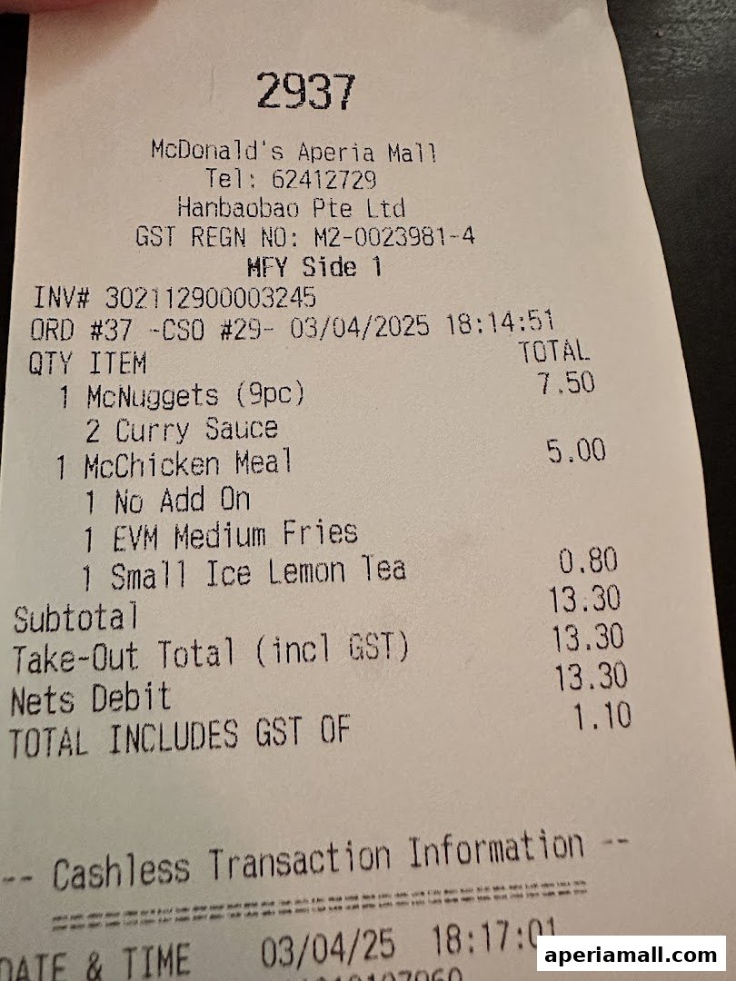 A McDonald's receipt showing a purchase of McNuggets, McChicken Meal, fries, and tea.