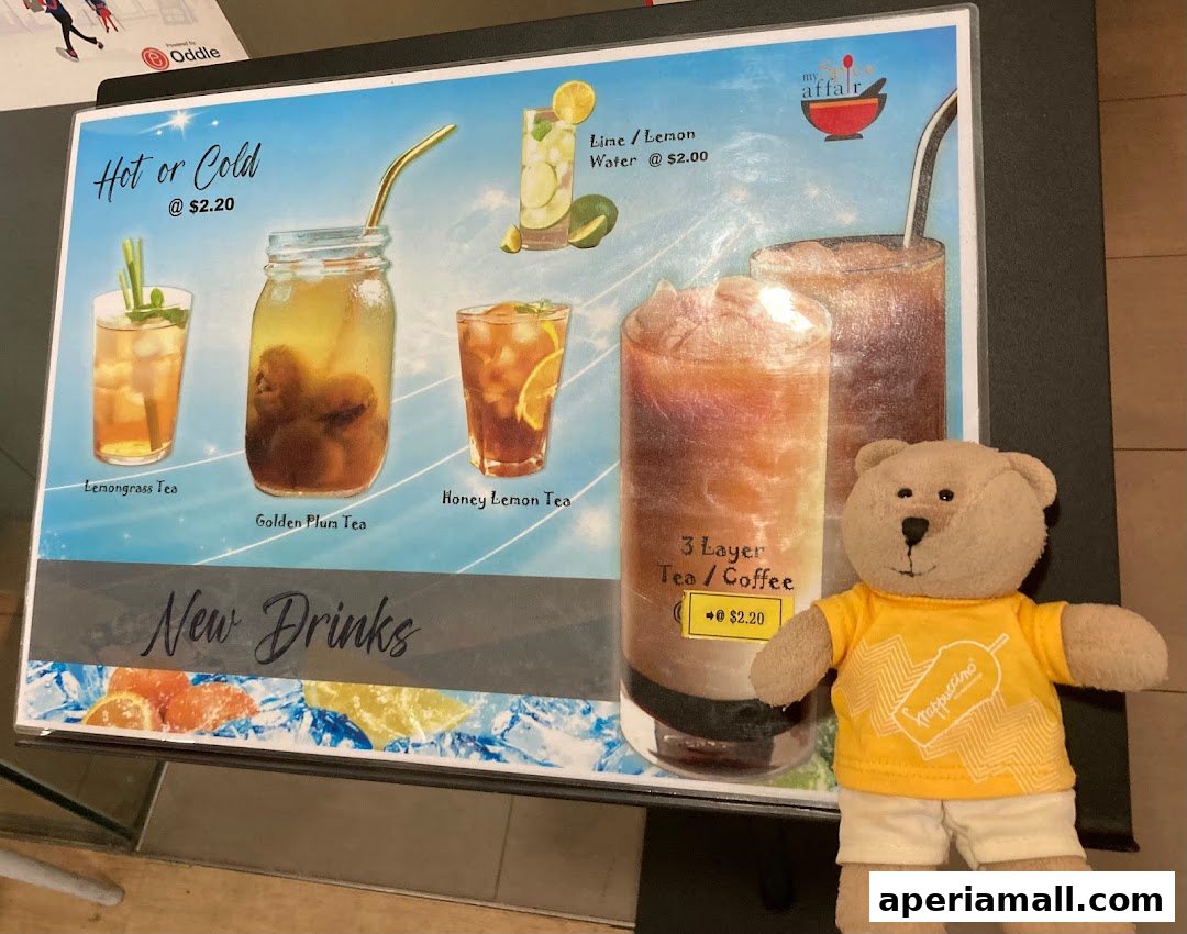A menu board displaying various drinks from 'My Spice Affair' with a teddy bear.