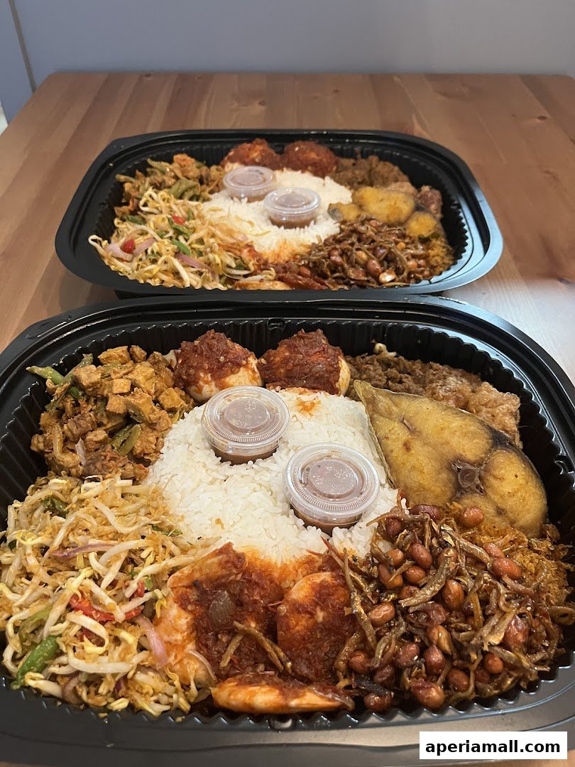 Two takeaway containers filled with rice, fried fish, shrimp, and various side dishes.