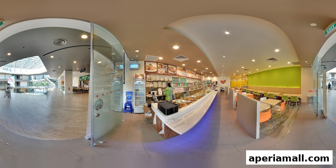 Interior view of a food stall with a serving counter, seating area, and mall walkway.