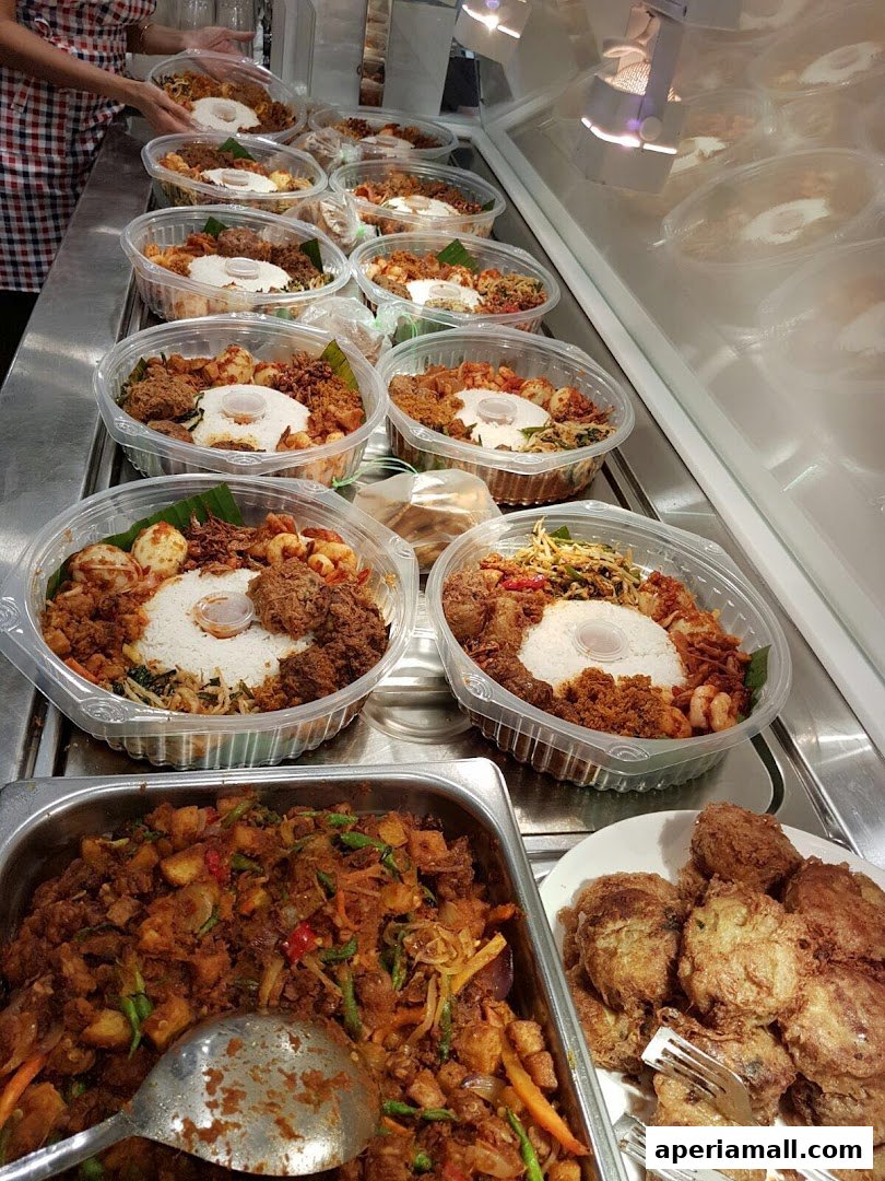 A display of pre-packaged meals in clear plastic containers, ready for takeaway.