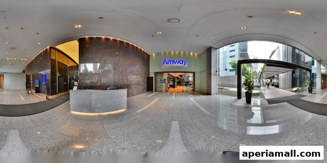 The entrance to the Amway shop in Aperia Mall, featuring a reception desk and modern interior design.
