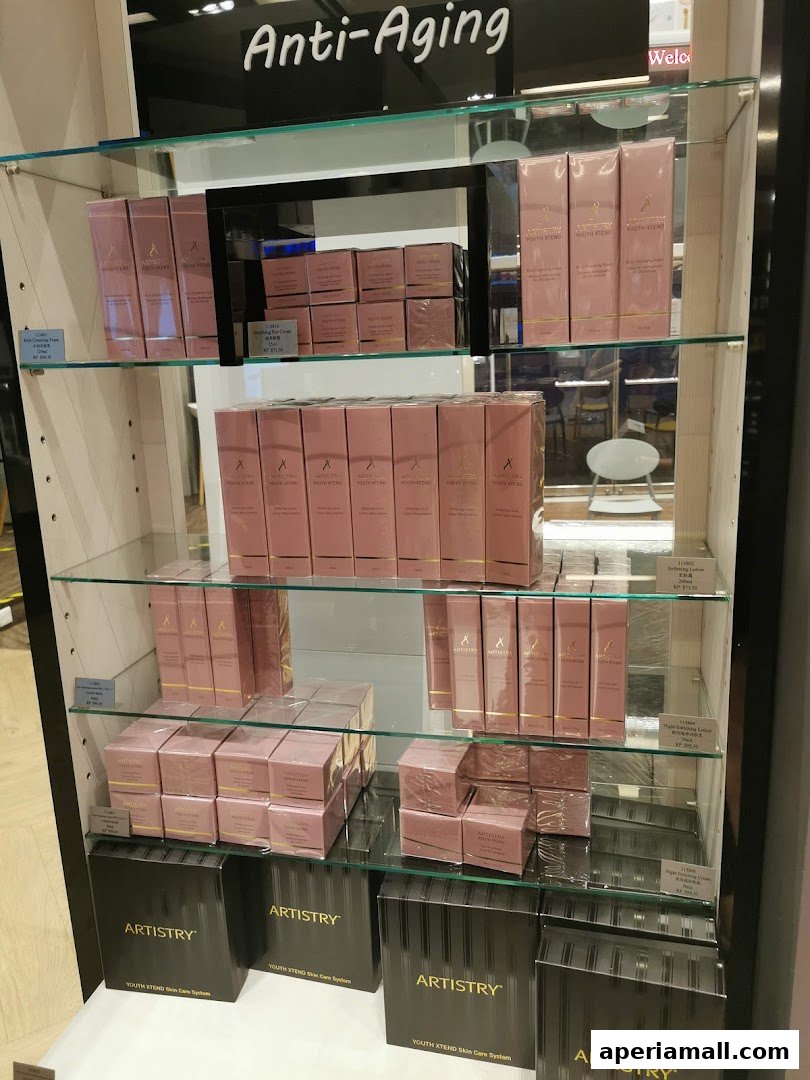 Display shelves showcasing ARTISTRY Youth XTend skincare products with 'Anti-Aging' signage.