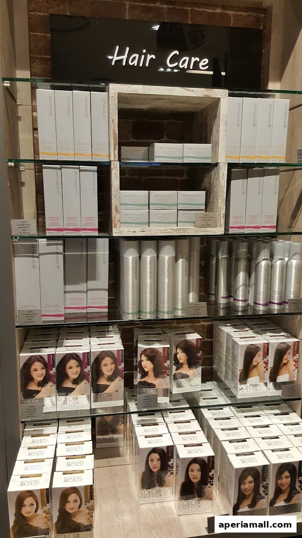 Shelves display various hair care products, including boxes of hair color and styling sprays.