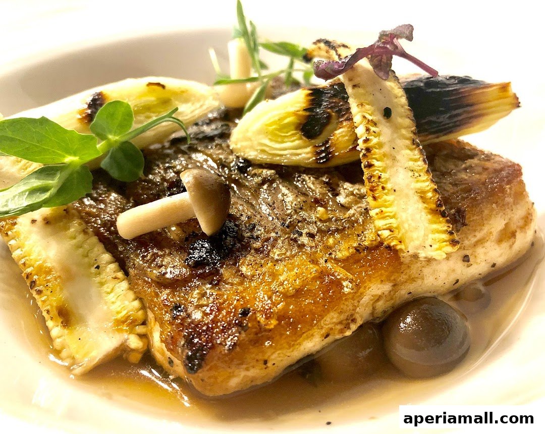 A close-up of a gourmet dish featuring pan-seared fish with grilled leeks and mushrooms.