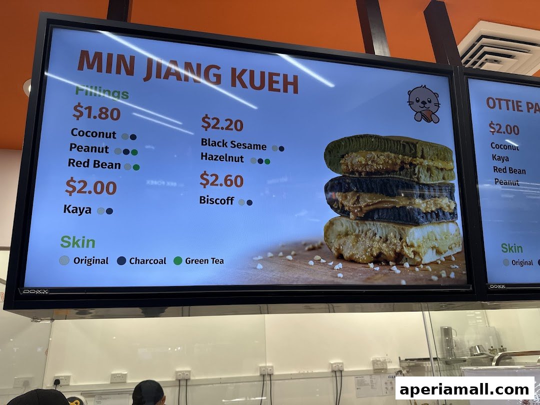 A digital menu board displaying various fillings and skin options for Min Jiang Kueh.