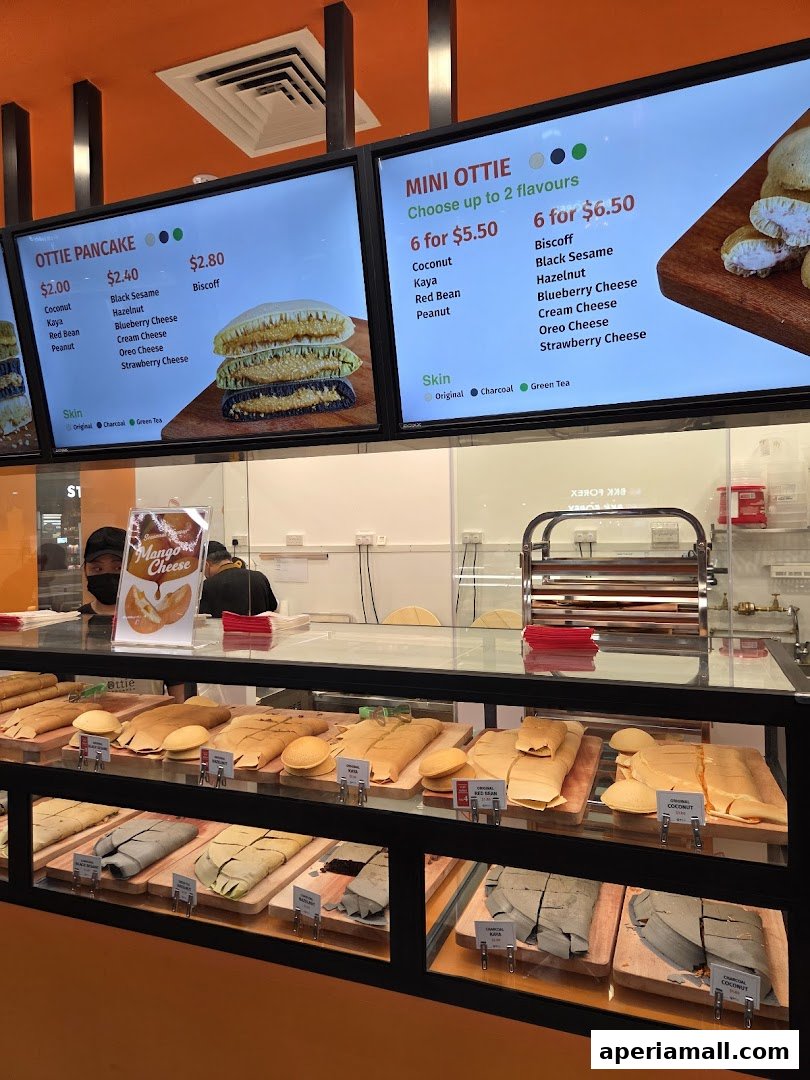 A display of Ottie Pancakes with various flavors and sizes offered, along with their prices.