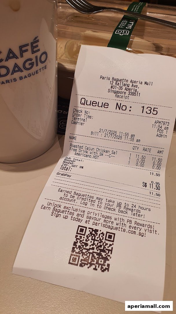 A receipt from Paris Baguette Aperia Mall showing a food order and payment details.