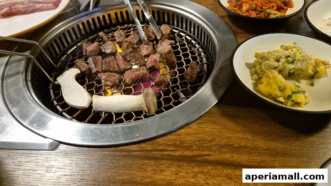 Juicy beef and mushrooms are grilled on a hot plate with side dishes.