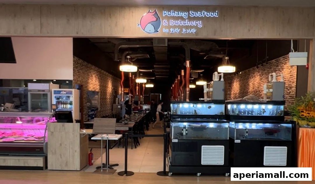 The entrance of Pohang Seafood & Butchery, featuring fresh seafood tanks and a butchery display.