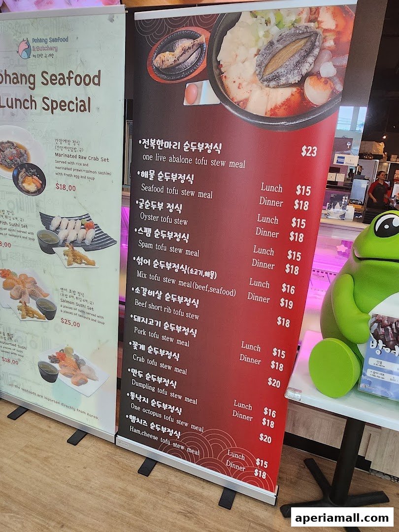 A menu board displays various Korean tofu stew specials with prices and descriptions.
