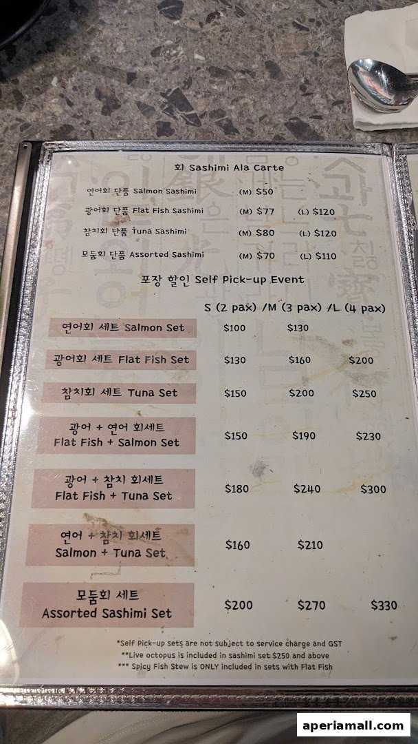 A menu featuring sashimi and set meals with prices for different sizes and pax.