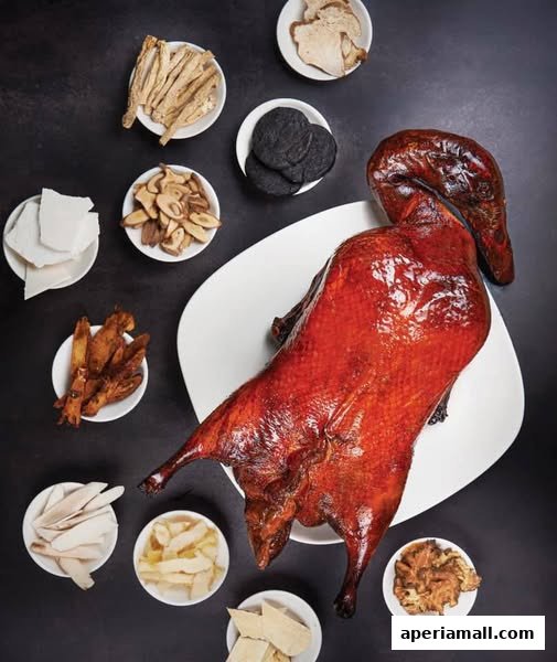 A whole roasted duck is presented with various ingredients in small bowls.