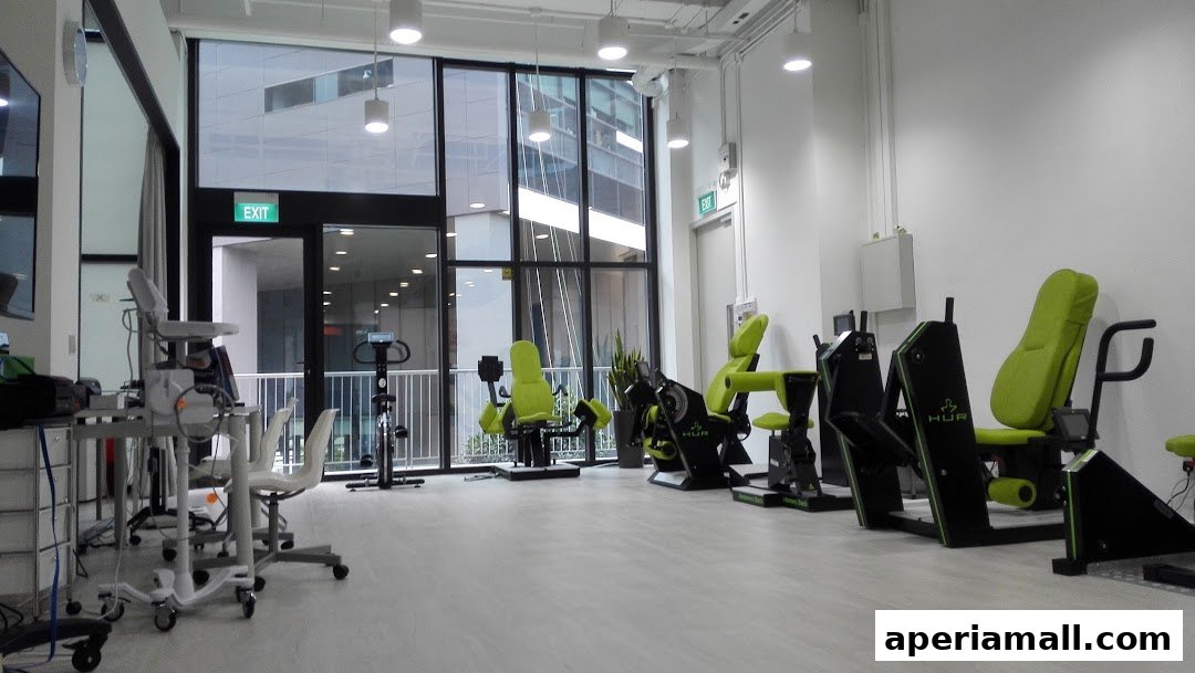 Interior of a modern gym with various exercise machines and medical equipment.