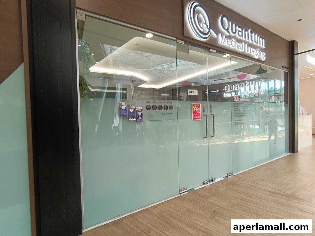 The entrance to Quantum Medical Imaging, a modern clinic with glass doors and signage.