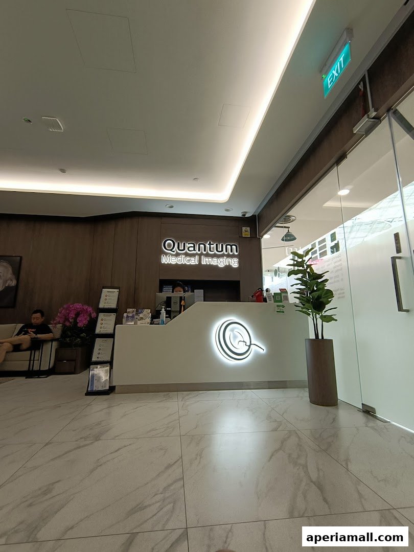 The reception area of Quantum Medical Imaging with a prominent logo and seating.