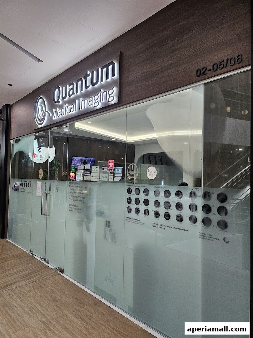 The exterior of Quantum Medical Imaging, a clinic with frosted glass doors and signage.