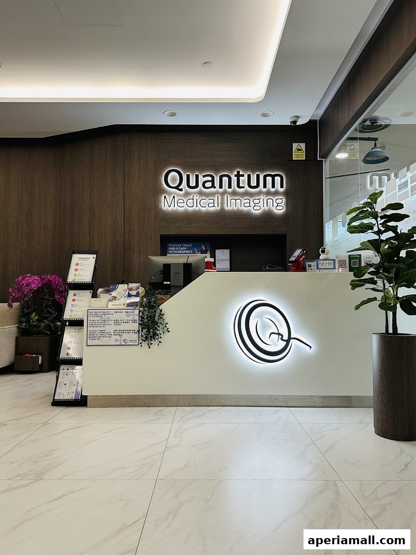 The reception area of Quantum Medical Imaging with a prominent logo and modern decor.