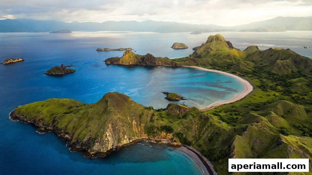 Aerial view of a stunning tropical island landscape with green hills and turquoise waters.